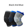 Silicone massage spring bar knee protector in cotton, shown in black and blue colour on a leg.