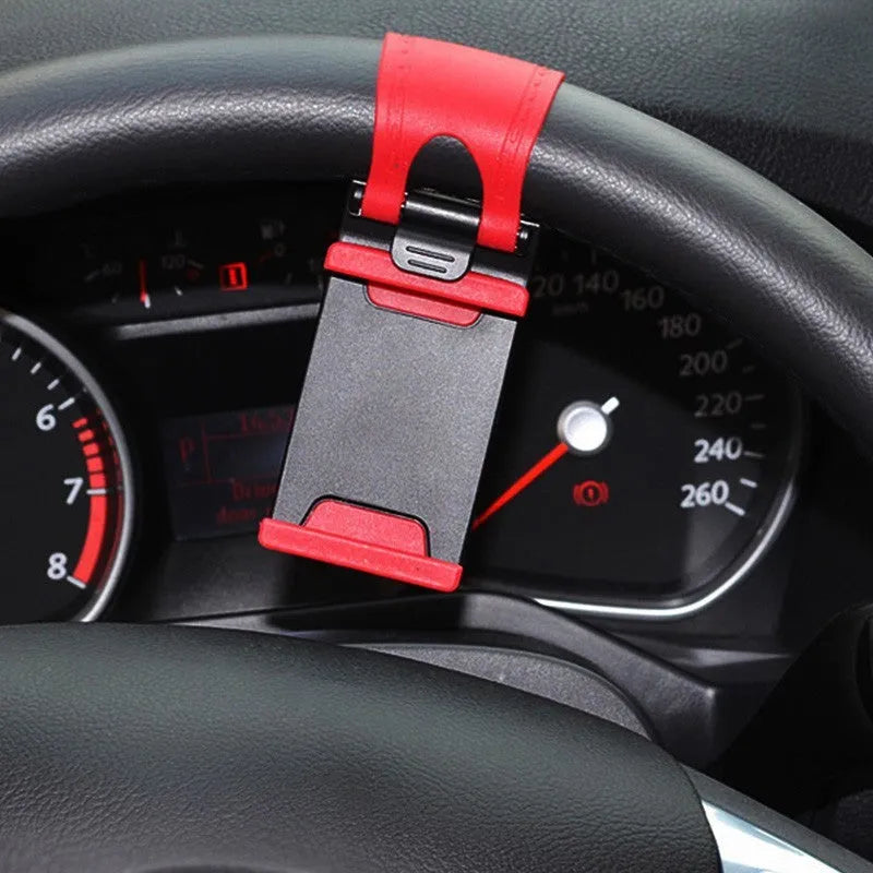 Black car steering wheel clip mount holding mobile phone for hands-free navigation