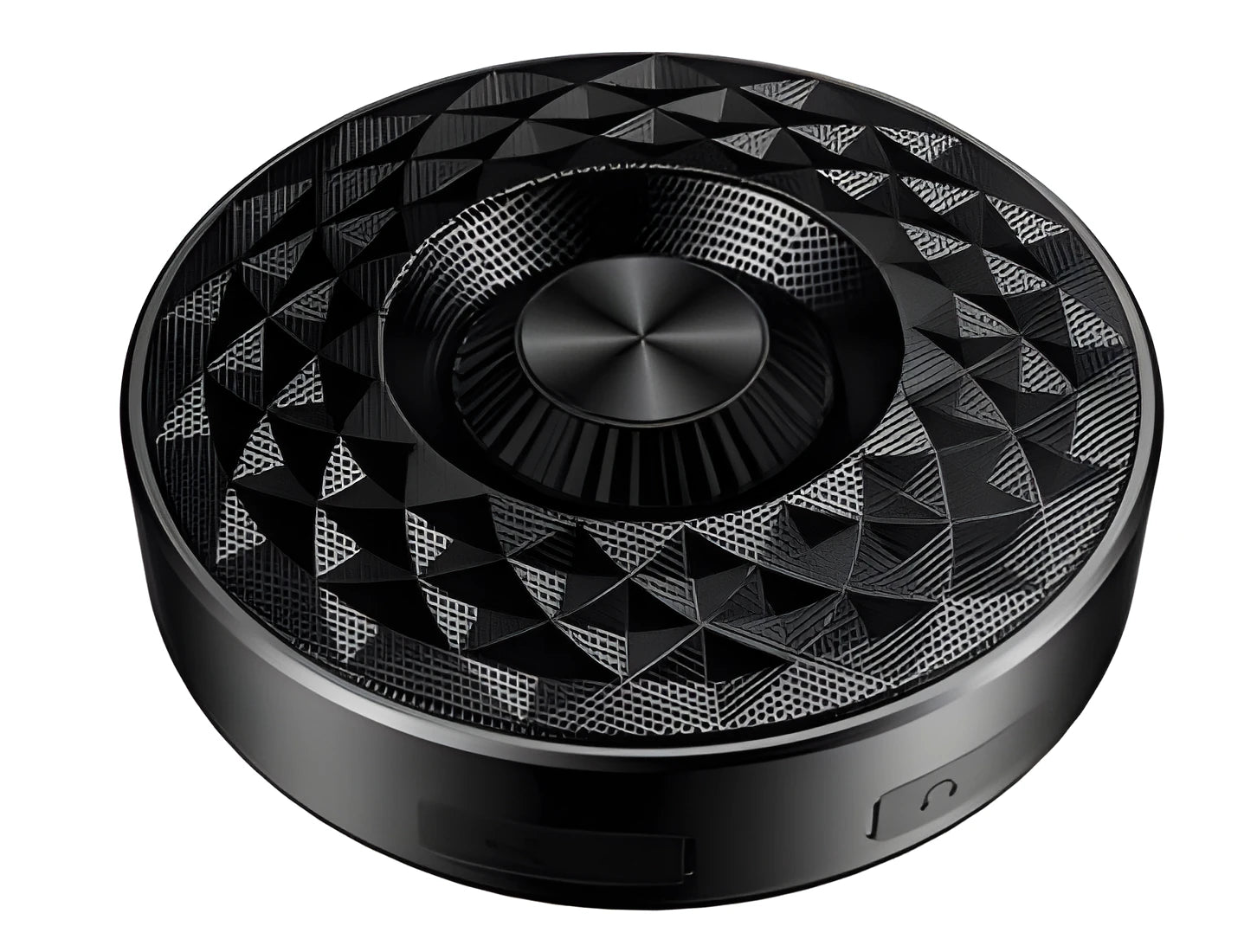 Compact black/orange/silver white portable Bluetooth speaker on a surface, showing its 360-degree grille.