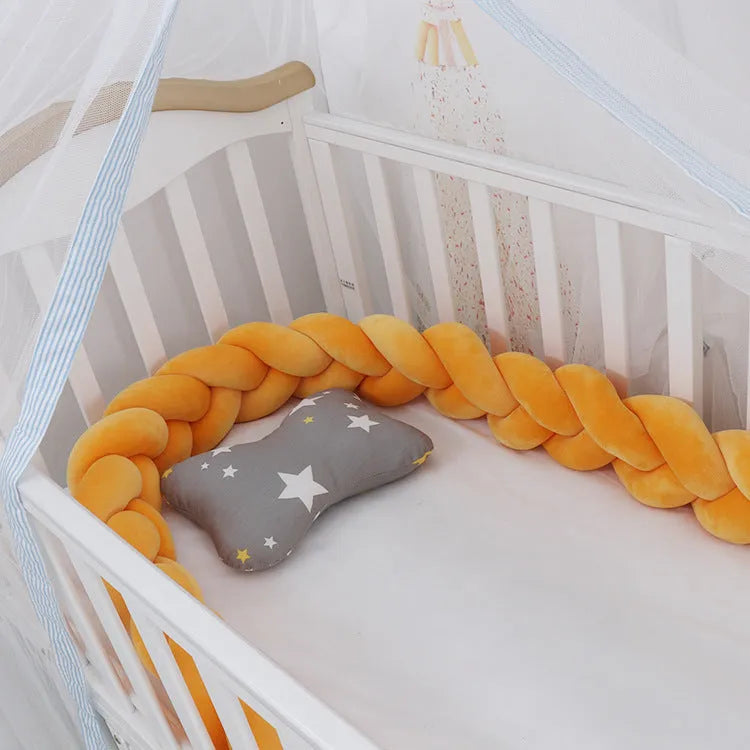 Braided knot cot bumper cushion in spandex velvet for crib safety protection.