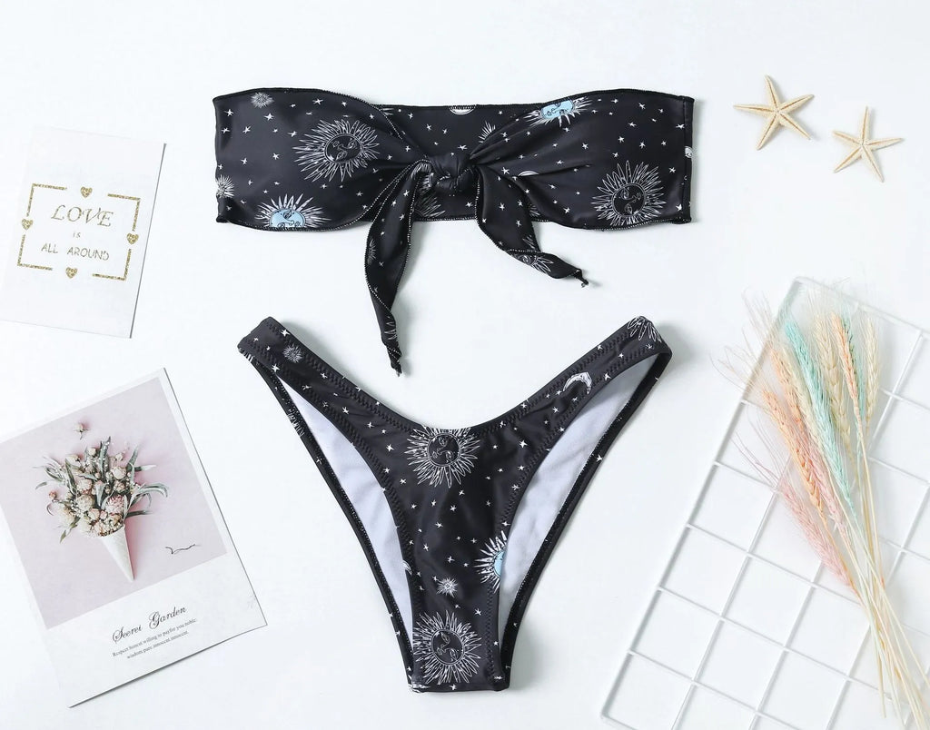 Black nylon one-piece swimsuit with bikini print pattern and backless tube top design