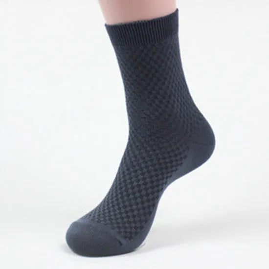 Men's bamboo fibre socks with a small square pattern in black, grey blue, iron grey, navy blue, and silver grey.