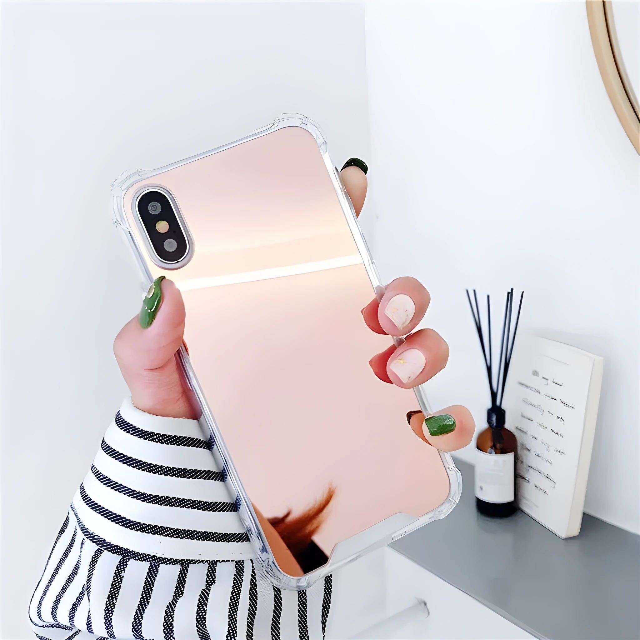 Soft TPU Mirror Phone Case for iPhone in multiple colours on a table.