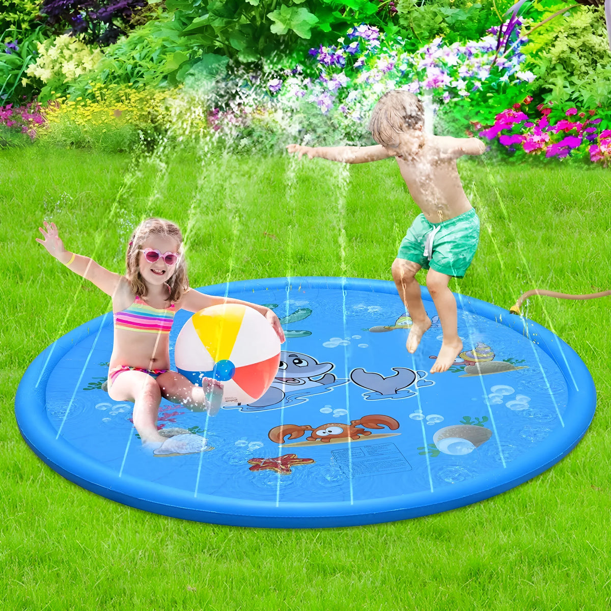 Blue PVC children's water spray mat with marine animal graphics, laid flat on grass.