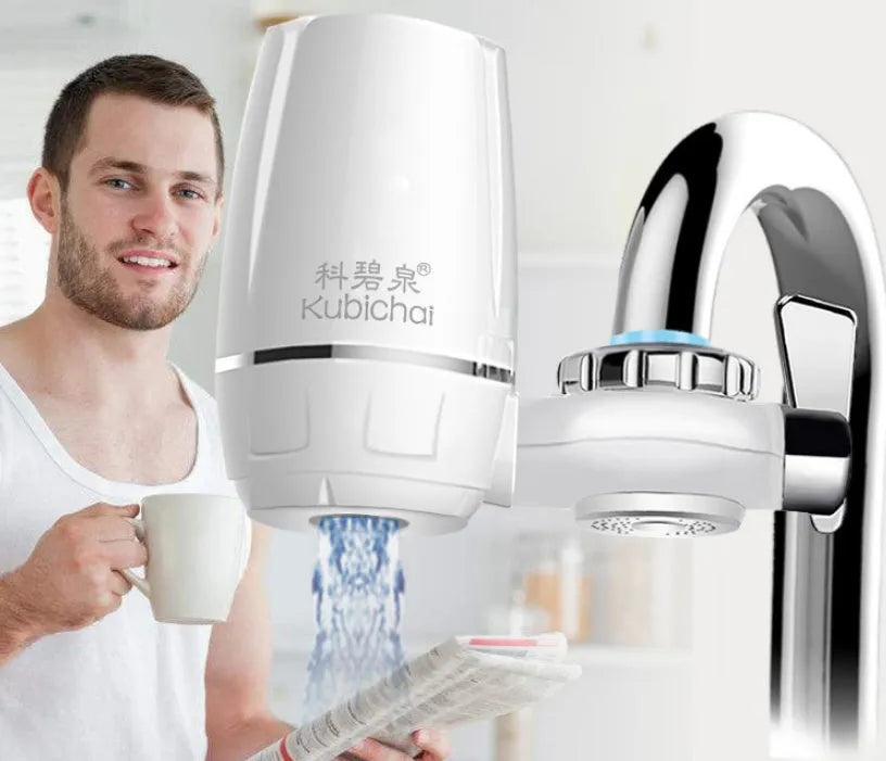 White plastic faucet water filter with adapter kit and ceramic cartridge for kitchen tap installation.