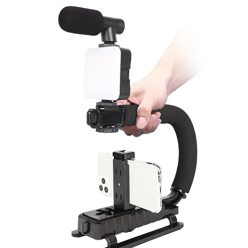 Square-shaped portable camera flash unit with adjustable head on mini tripod mount