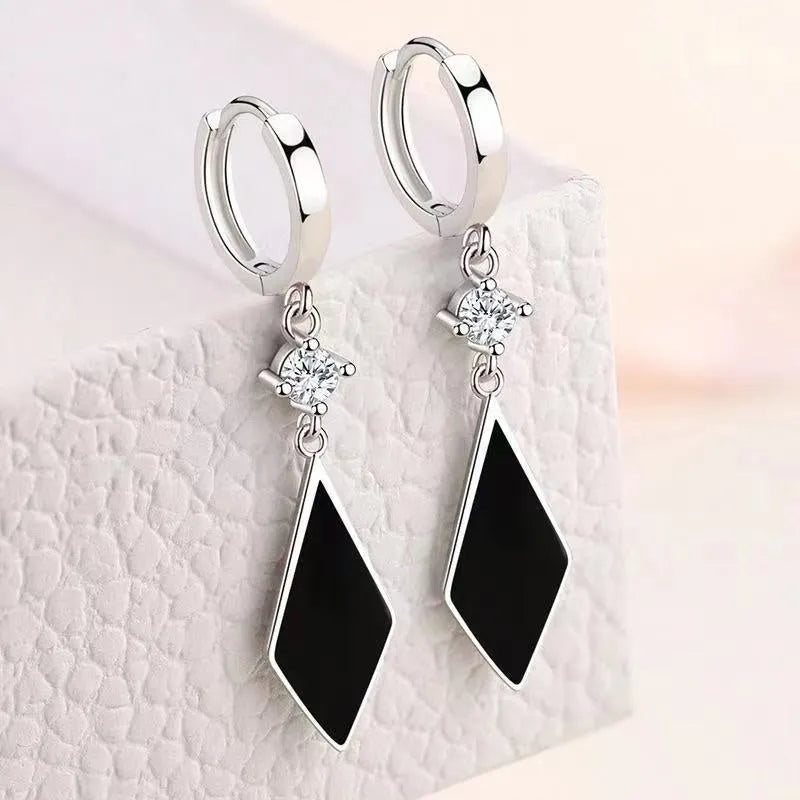 Vintage diamond clip-on earrings with geometric shapes in silver electroplated finish
