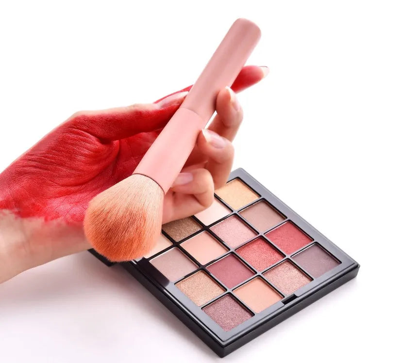 10 professional makeup brushes with wooden handles, including powder, foundation, and double-ended detail brushes.
