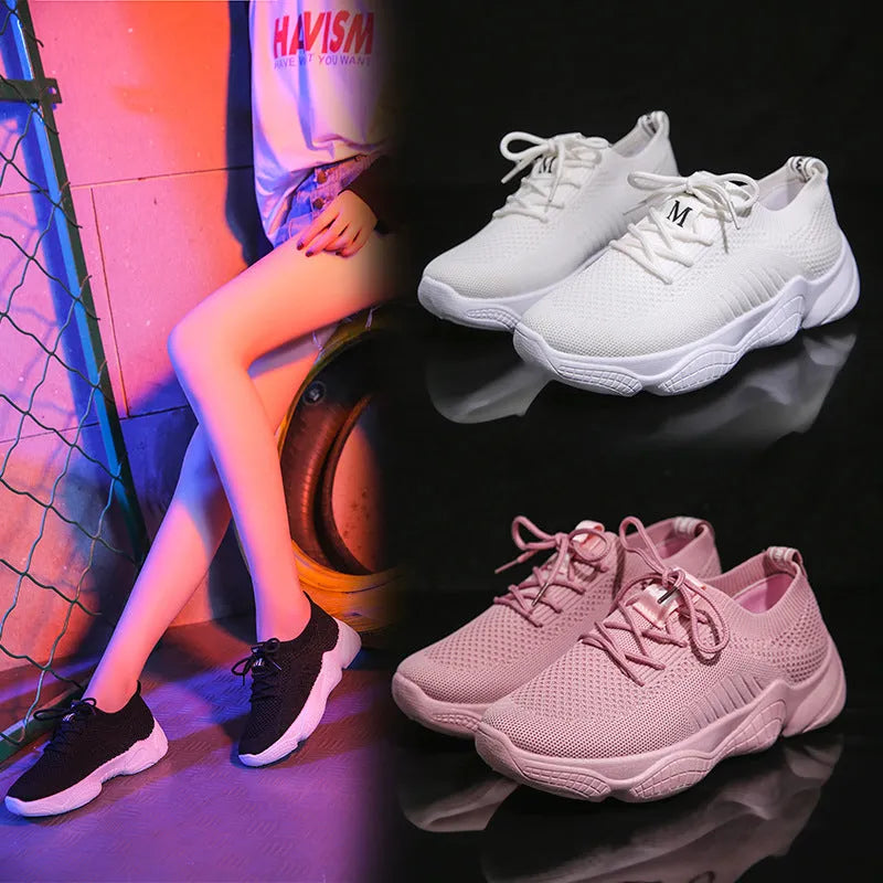 Women's white sport shoes with thick rubber soles and woven upper fabric with front strap closure