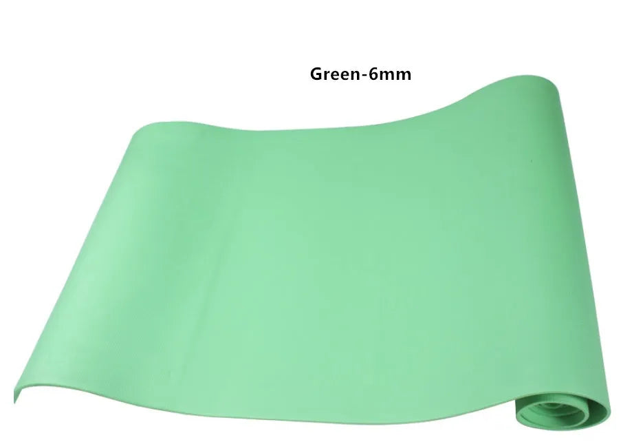 Red EVA fitness yoga mat showing texture and thickness, rolled partially with carry bag.