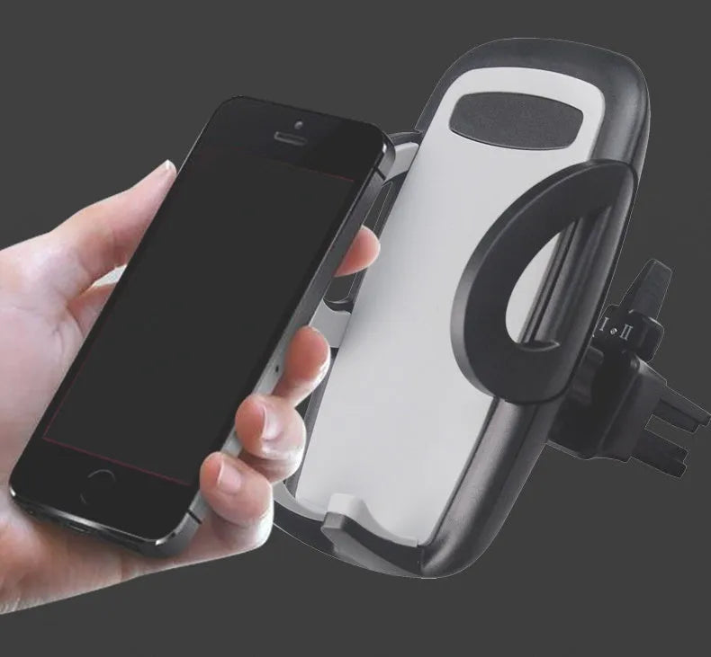 Black mobile phone holder clipped to car air conditioning vent with smartphone mounted
