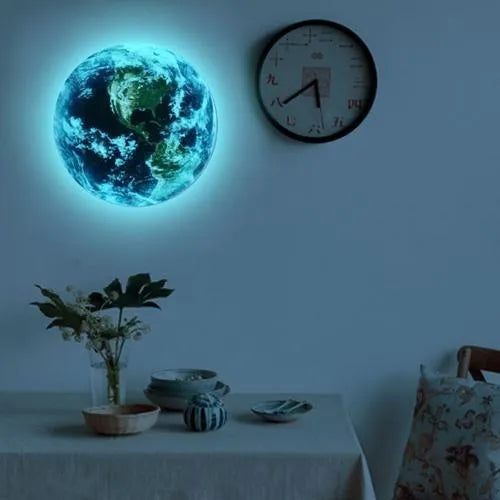 Glow in the dark blue and green Earth planet wall sticker on a bedroom wall.