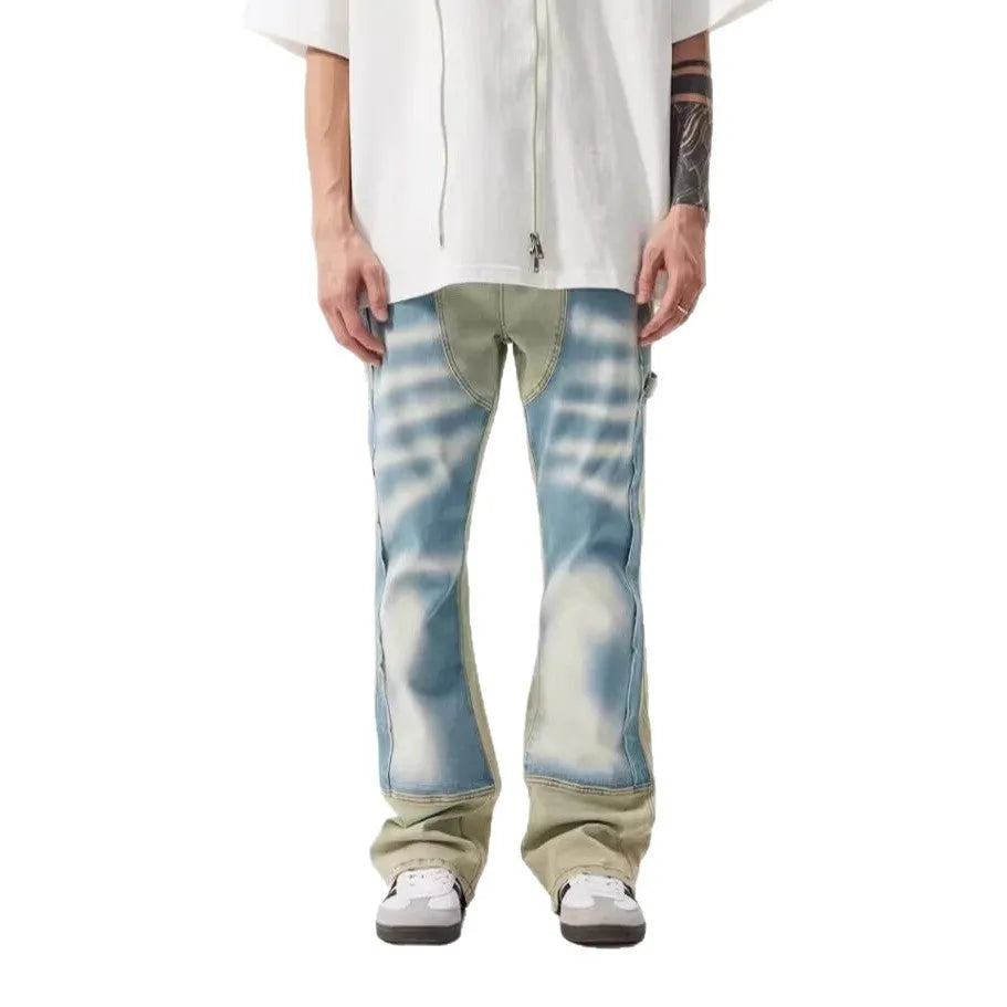 Retro yellow and blue patchwork jeans with splash-ink distressing, mid-waist cut with zip fly