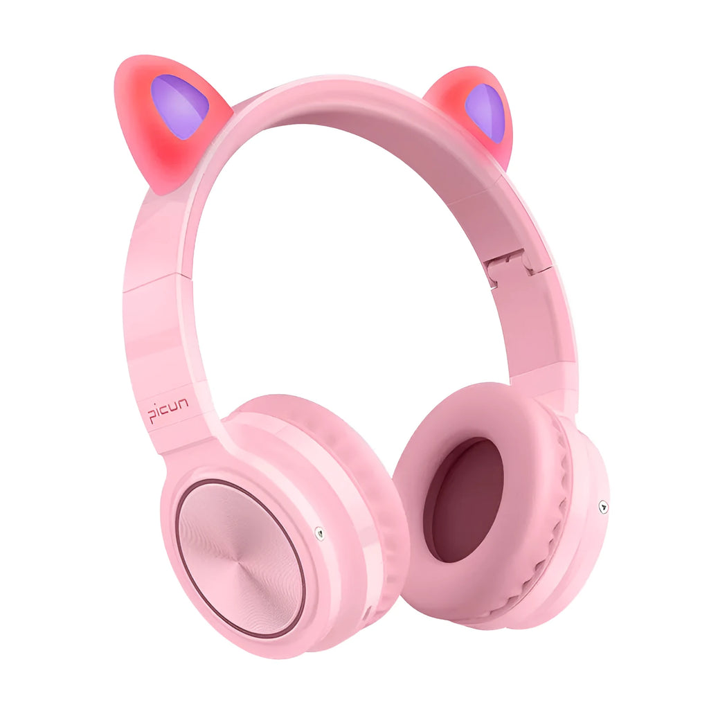 Pink and white wireless Bluetooth over-ear headset with a braided cable on a grey background.