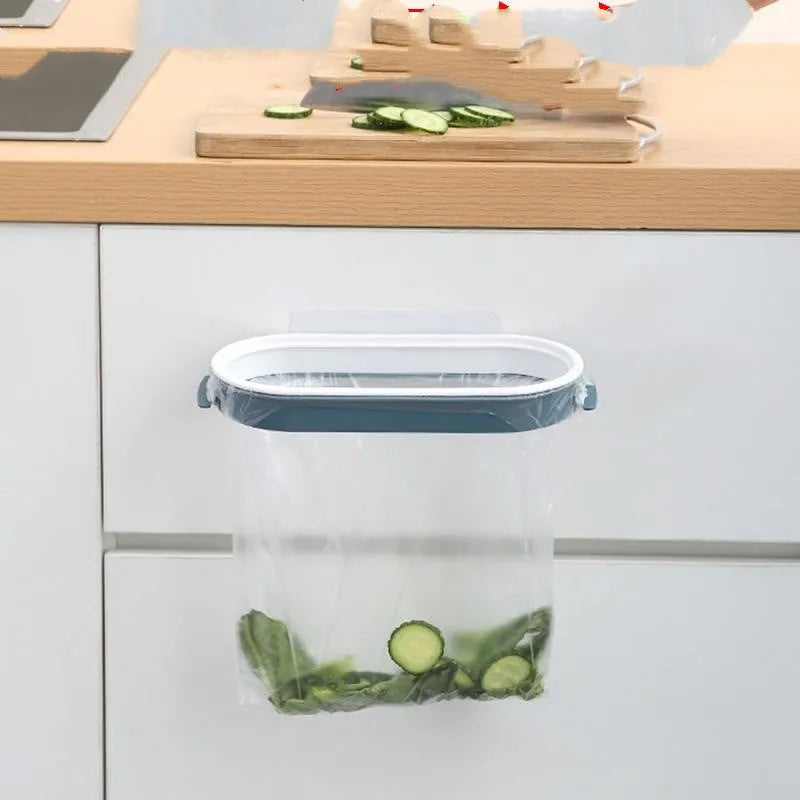 Blue plastic kitchen garbage bag storage rack on a worktop.