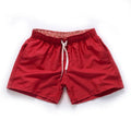 Men's polyester beach shorts for surfing in multiple colours including black white red and fluorescent options