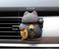 Black and white resin fortune cat car vent aromatherapy clip with aromatherapy cotton.