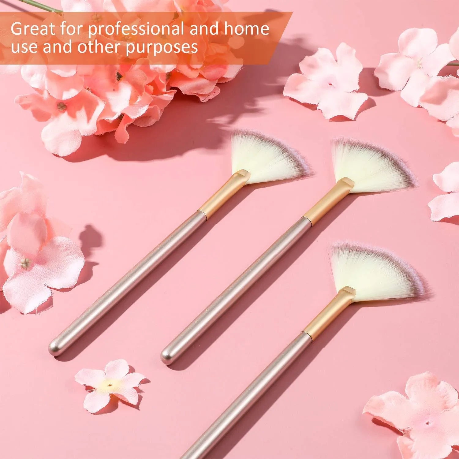 Set of 10 professional facial fan brushes with champagne finish and acrylic handles on a table.