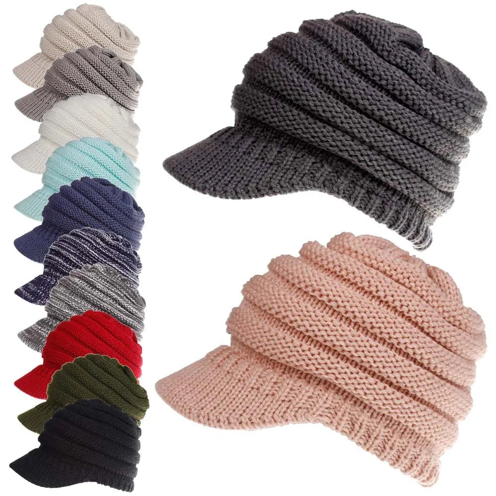 Woman wearing a soft knitted beanie with a ponytail pulled through the opening in the crown.