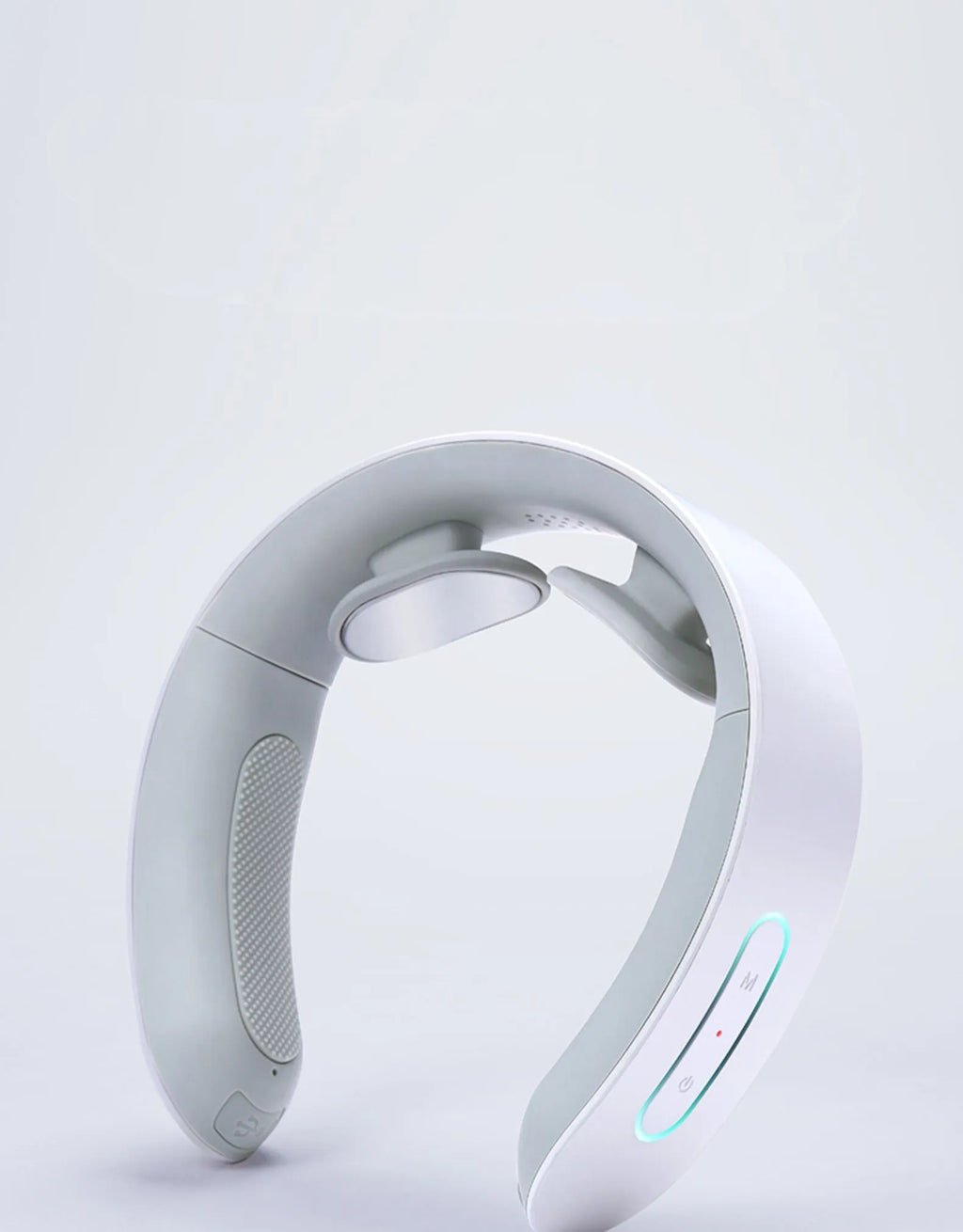 White electric acupressure massager for back neck and shoulder pain relief on a grey background.