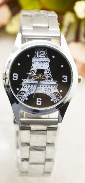 Eiffel Tower analogue wrist watch with black leather strap and Paris-themed dial.