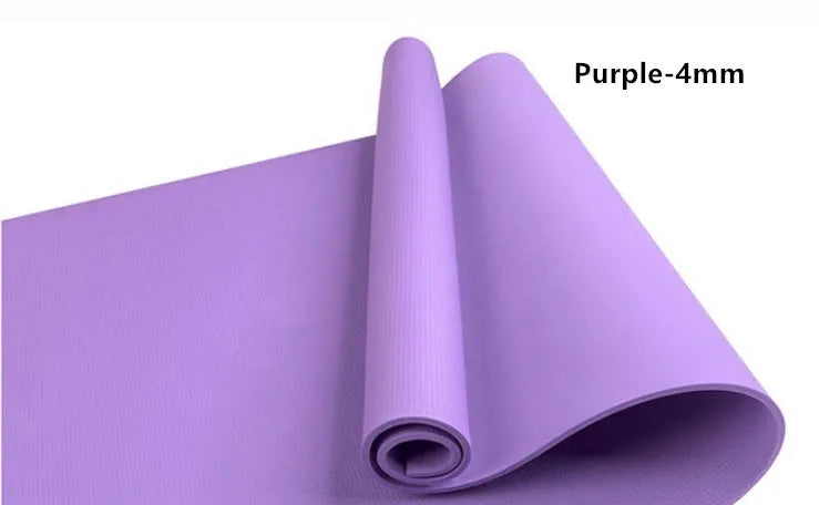 Red EVA fitness yoga mat showing texture and thickness, rolled partially with carry bag.