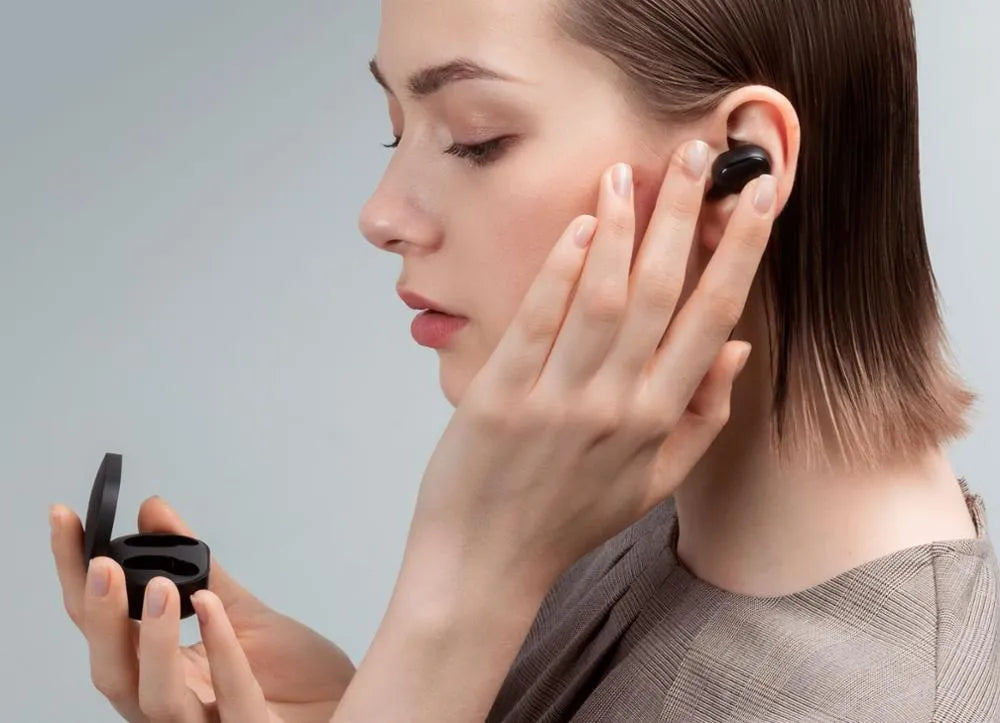 Redmi AirDots 2 black true wireless earbuds with charging case on a white background.