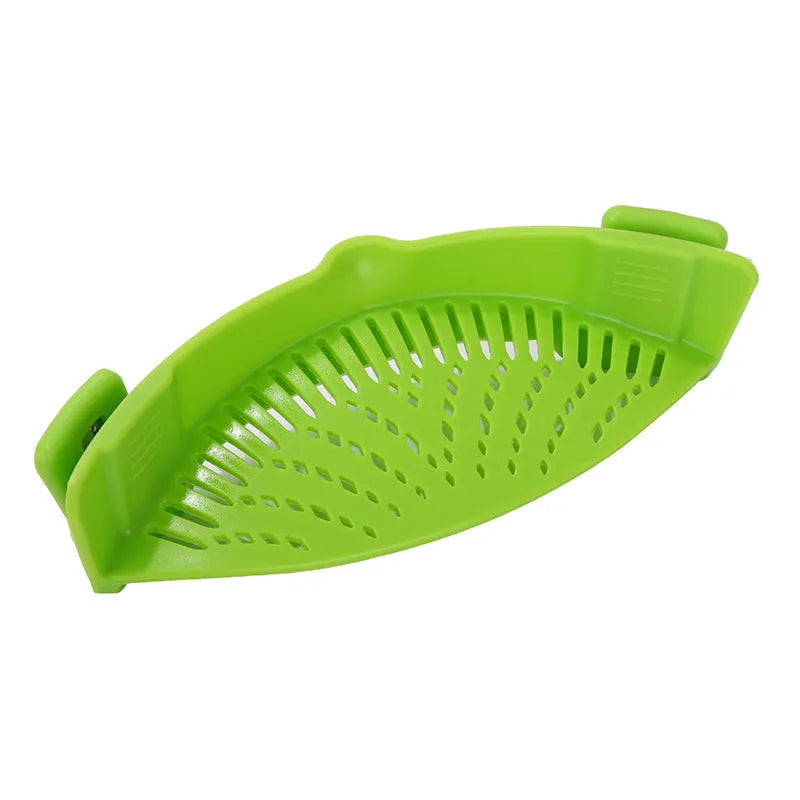 Silicone clip-on funnel colander in kitchen draining liquid from pot