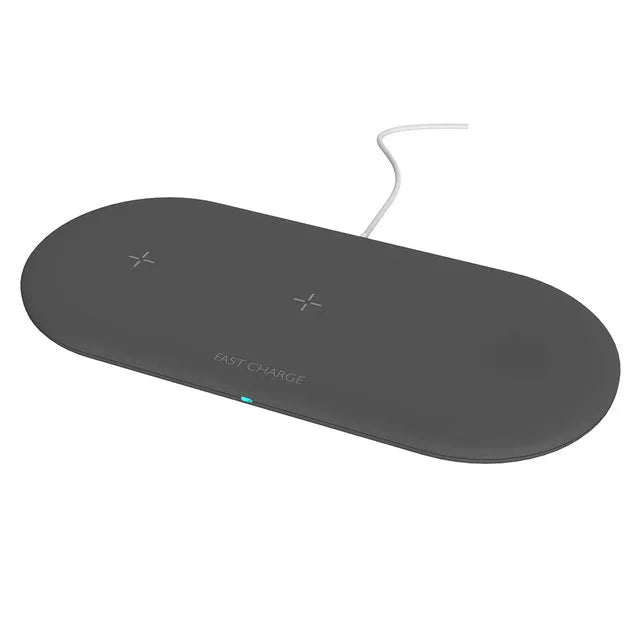Black 3-in-1 wireless charging station for iPhone, Apple Watch, and earbuds on a wooden desk