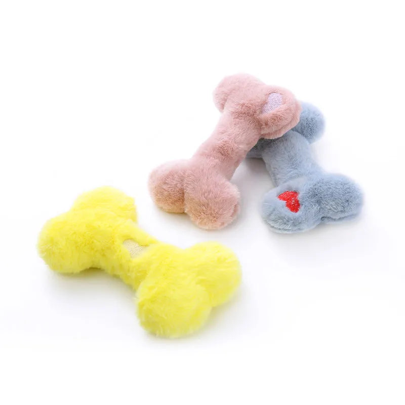 Blue plush bone-shaped dog toy with a squeaker, labelled Grinding Teeth, on a plain background