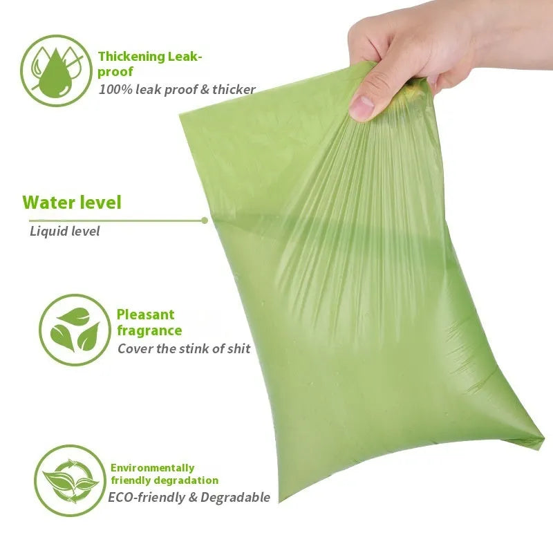Roll of green EPI degradable pet garbage bags next to a boxed set with a dispenser.