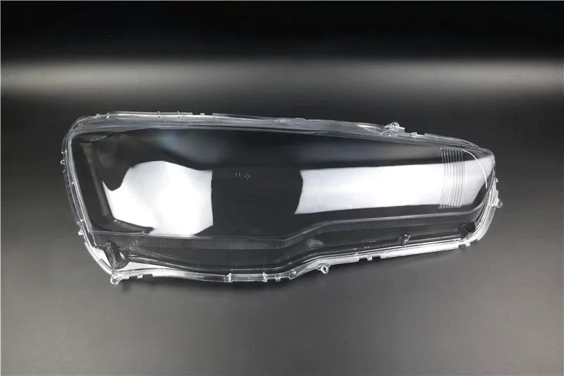 Transparent plastic headlight housing cover measuring 50x30x20mm for vehicle lampshade protection