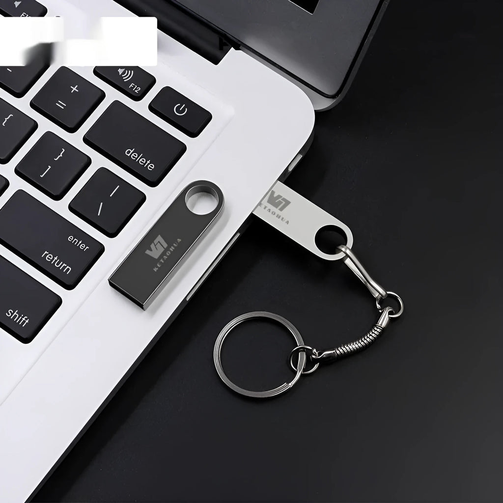 Metal car-shaped USB flash drive showing silver colour with compact dimensions