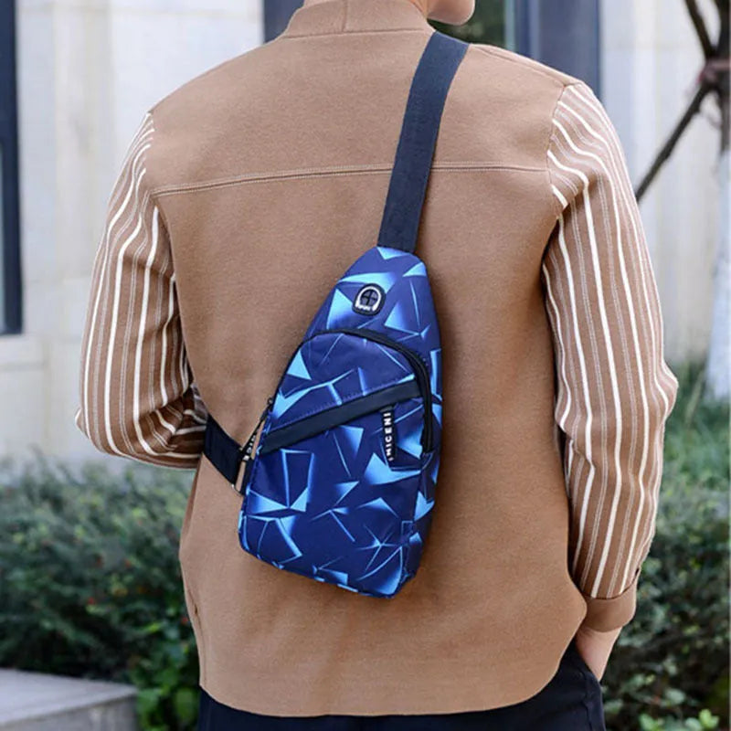Black Oxford cloth crossbody chest bag for men with a visible earphone hole and zipper.