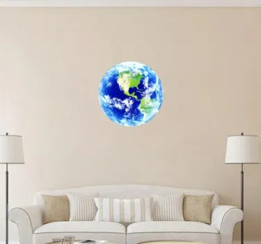 Glow in the dark blue and green Earth planet wall sticker on a bedroom wall.