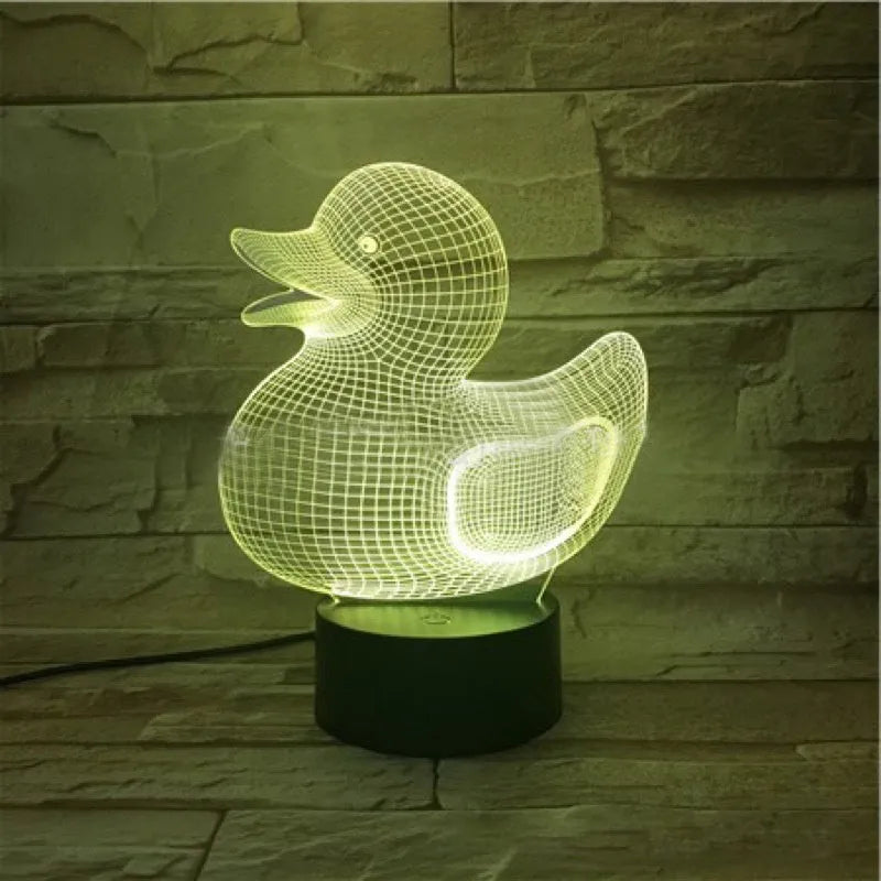 Little yellow duck 3D LED night light showing colour change modes on a desktop