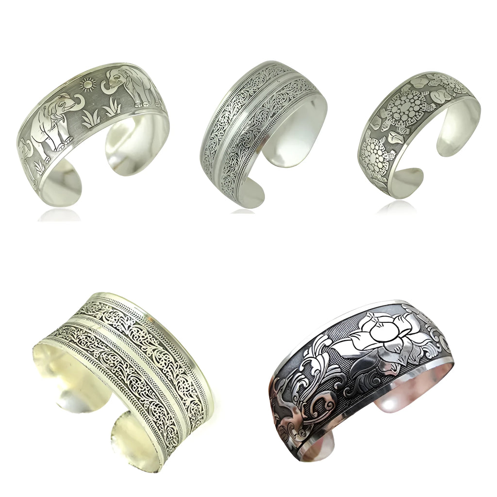 Ethnic carved open Miao silver bracelet showing turtle and elephant motifs