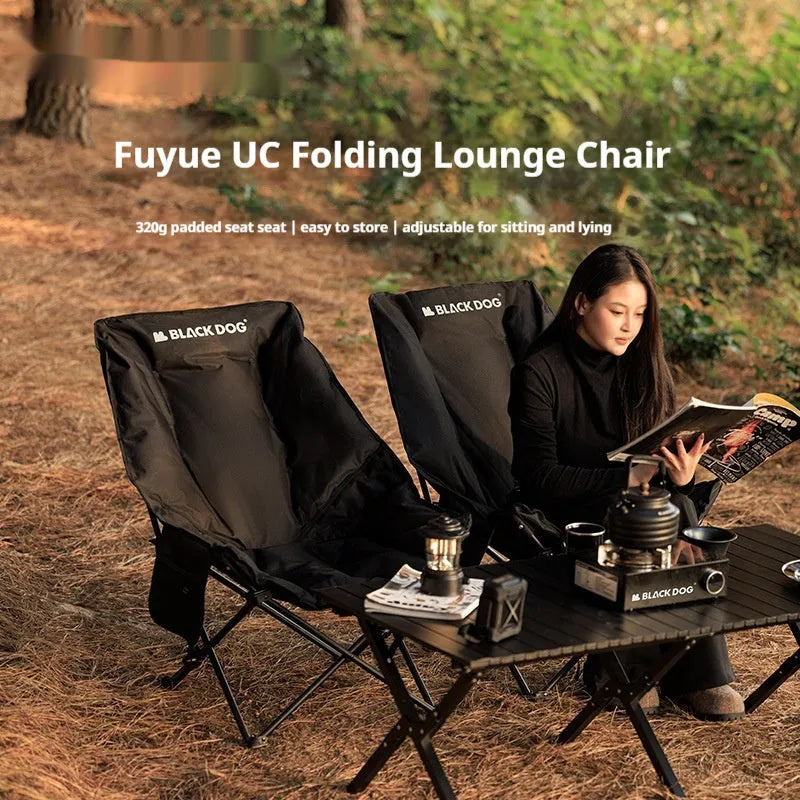 Night Black Oxford cloth camping recliner folding moon chair in outdoor setting