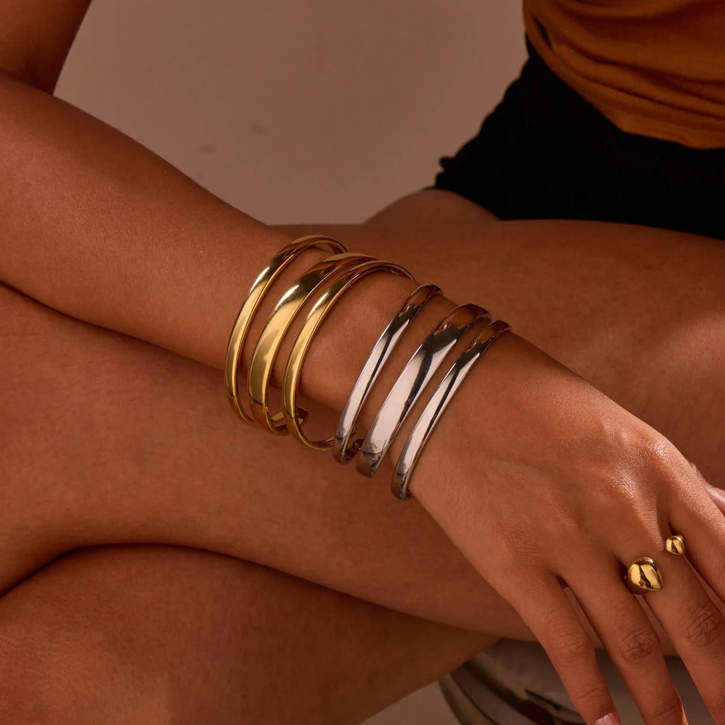 Gold electroplated stainless steel geometric line bracelet for women with a simple clasp.