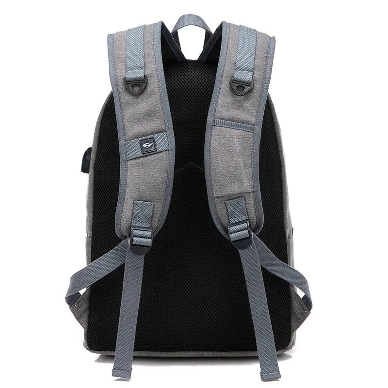 Canvas backpack with USB charging port and shoulder straps in khaki colour.