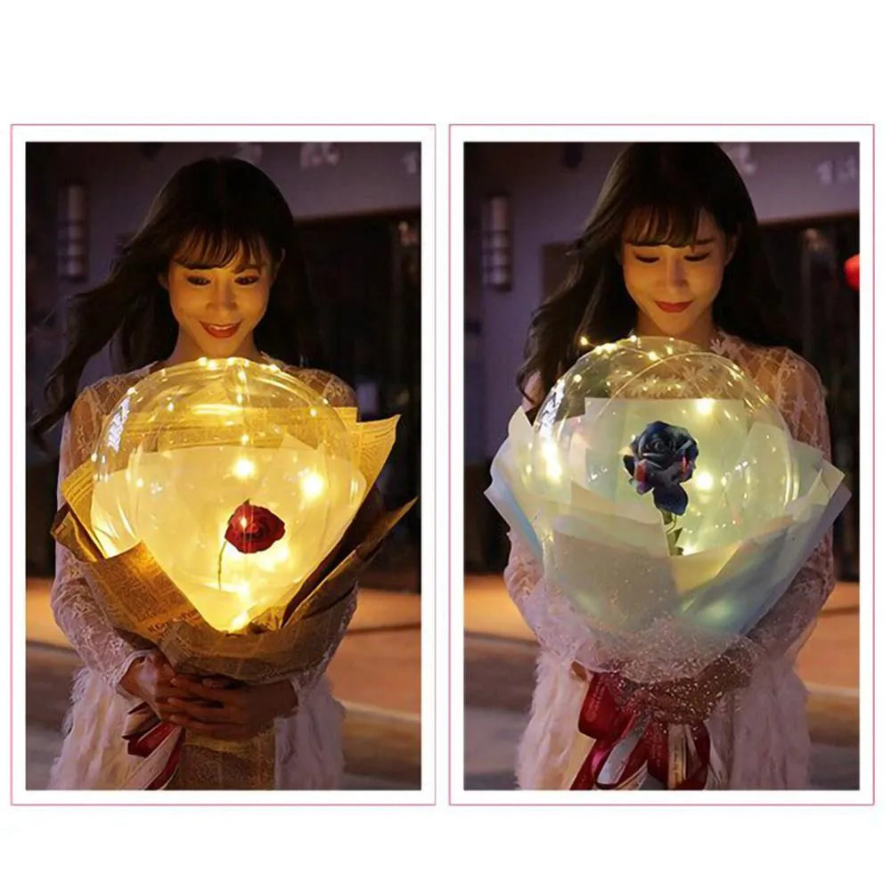 Transparent LED luminous balloon rose bouquet with artificial flowers and integrated lights for party decoration.