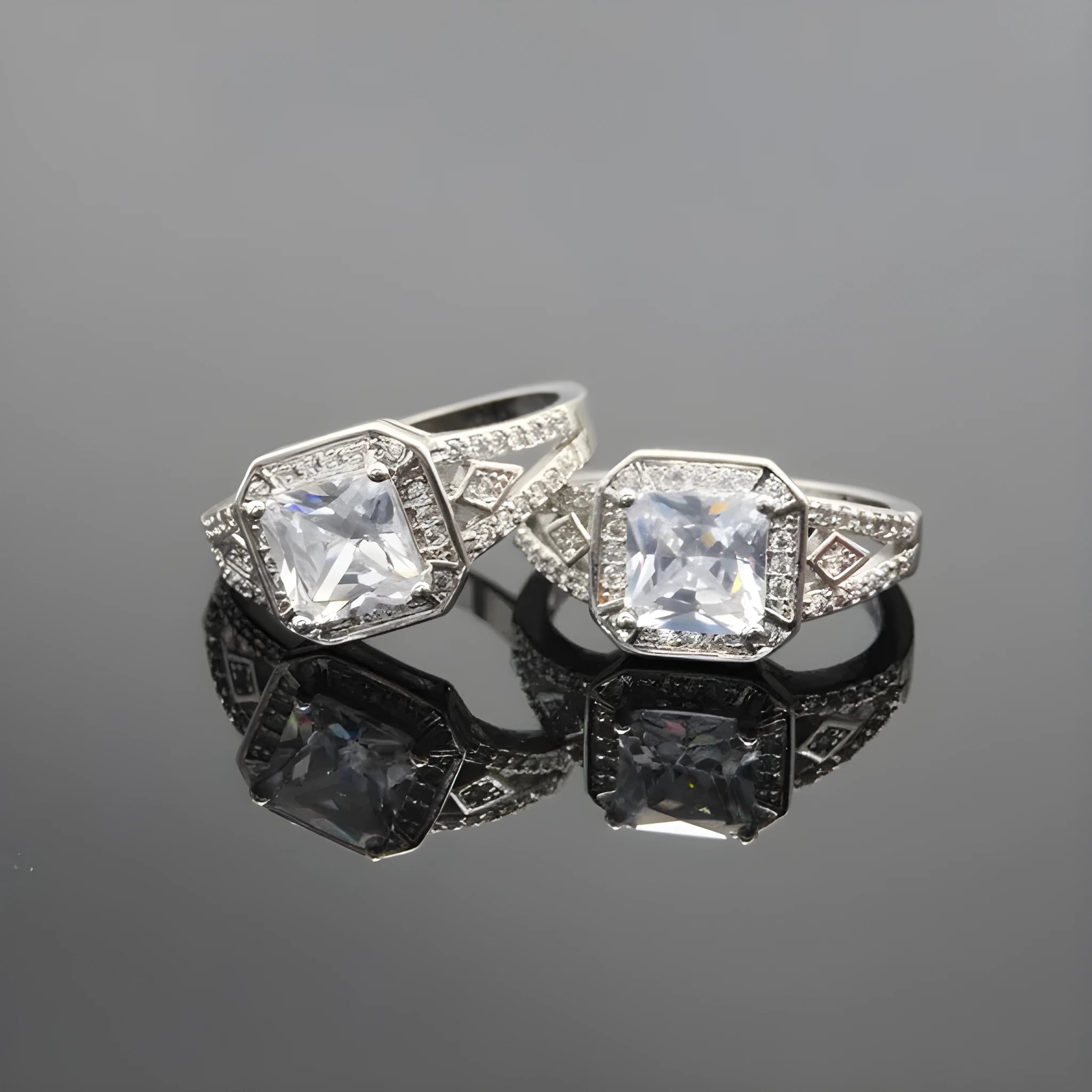 Platinum-colour zircon ring with hollow geometric quadrilateral design on a copper base