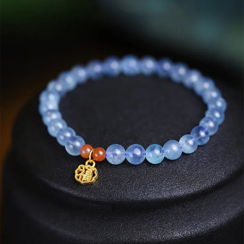Natural aquamarine crystal blessing card bracelet with icy translucent 8mm round beads and sequin accents.