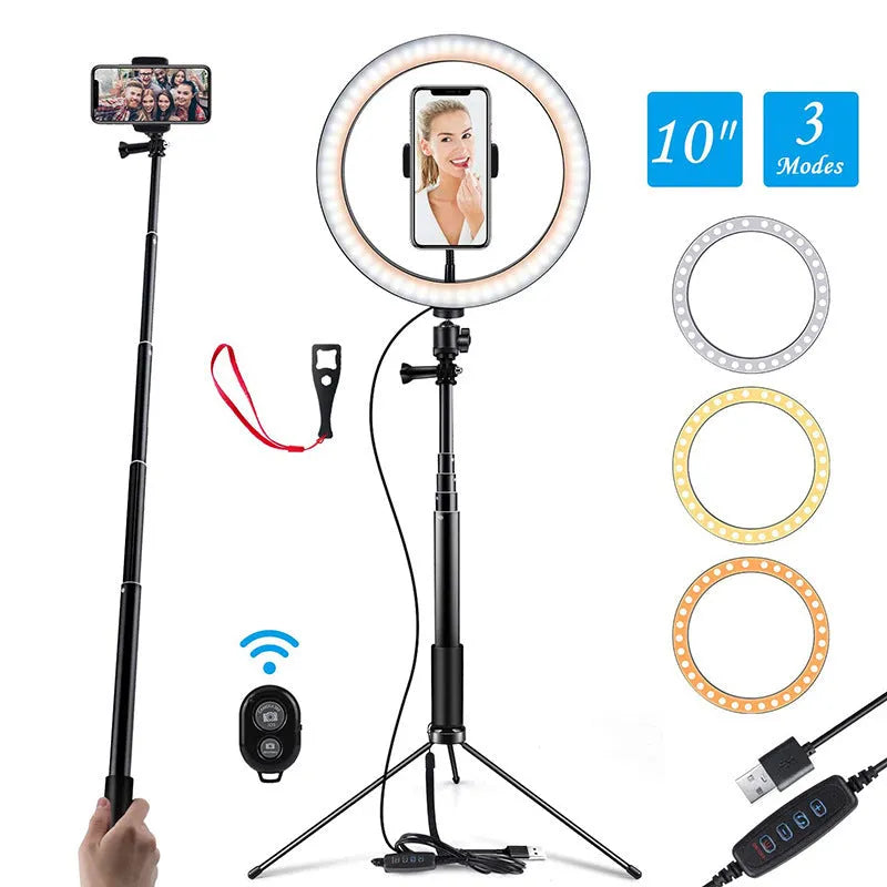 Black aluminium selfie stick tripod extended next to a smartphone, showing its 5-section telescopic shaft.