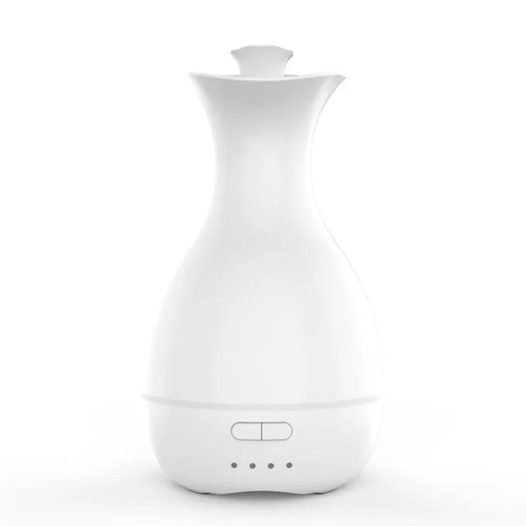 White ultrasonic aromatherapy vase humidifier with colourful LED night light and 200ml water tank.