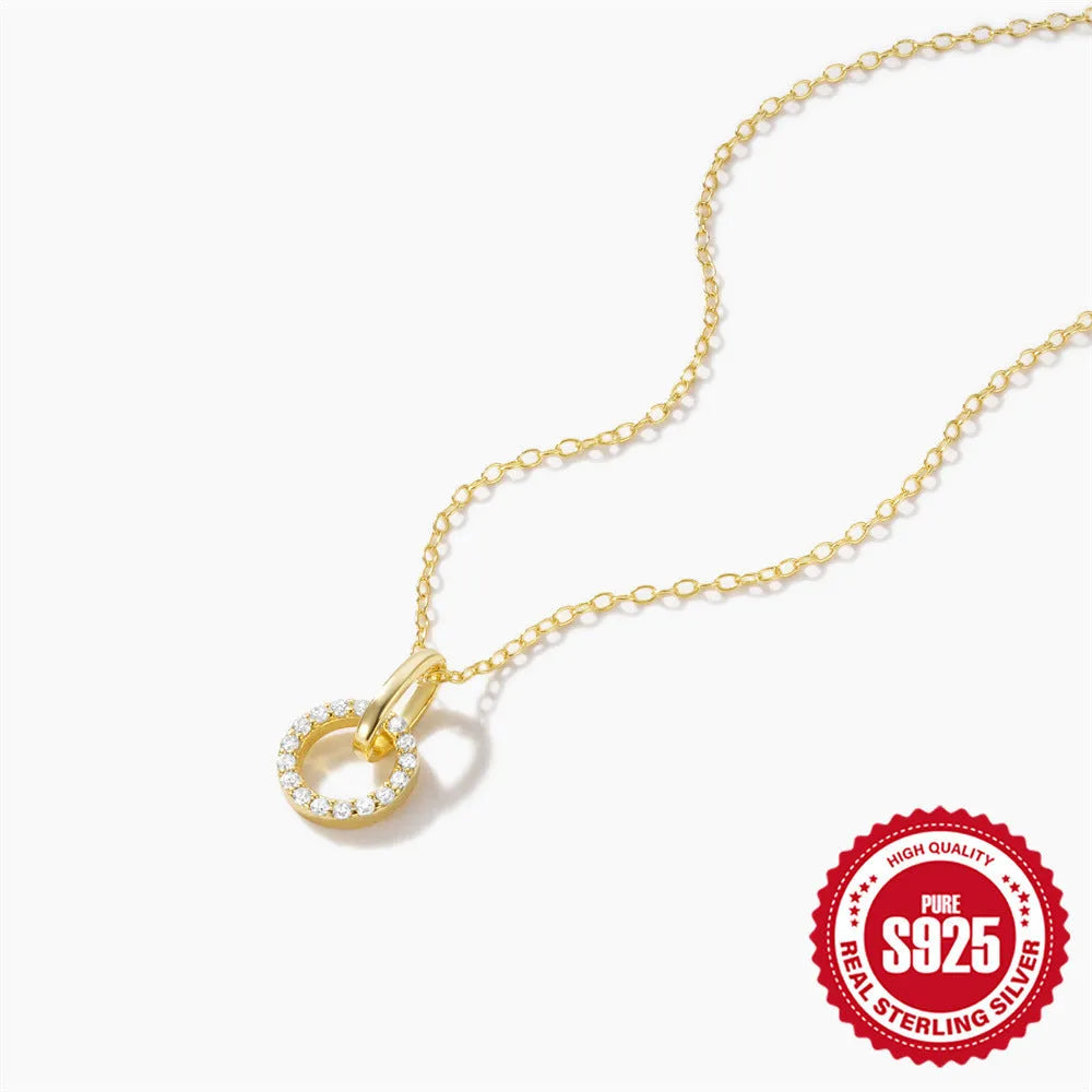 Gold tone S925 sterling silver clavicle chain with geometric interlocking zircon pendant.