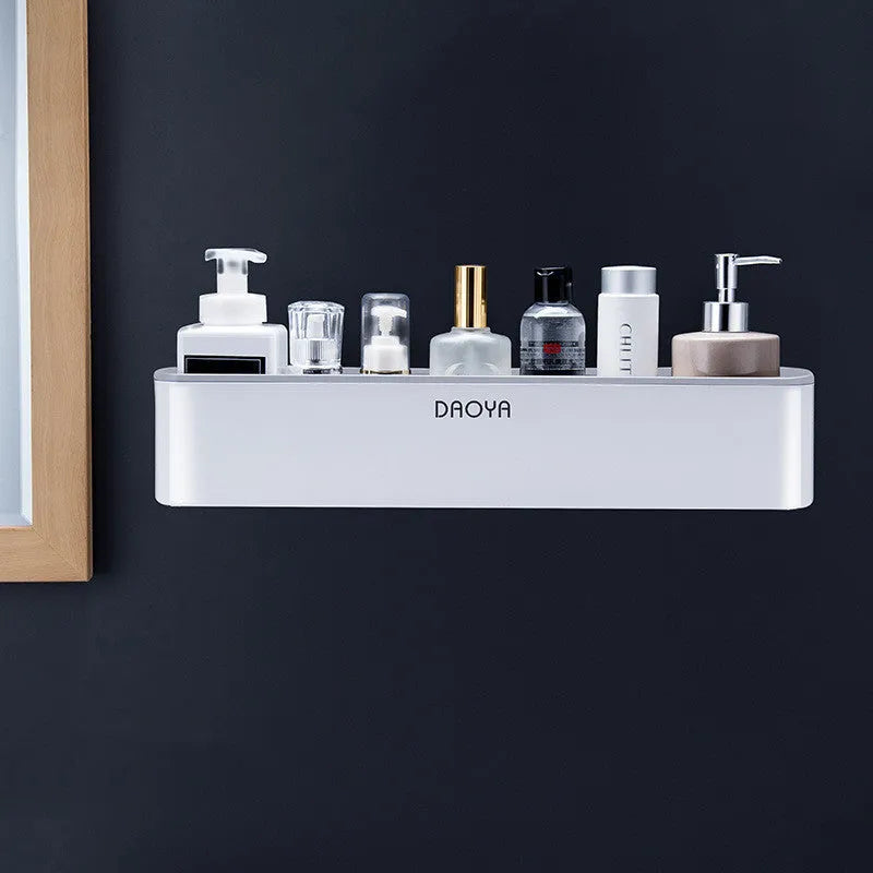 Black wall-mounted bathroom shelf with hole-free installation holding shampoo and shower gel bottles