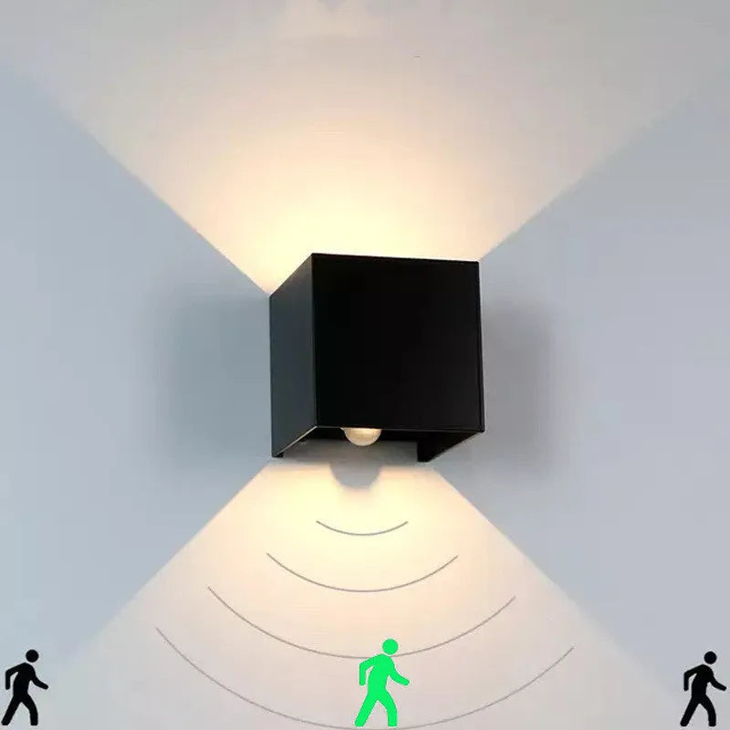 Compact cubic corridor wall lamp in black finish with adjustable colour temperature settings
