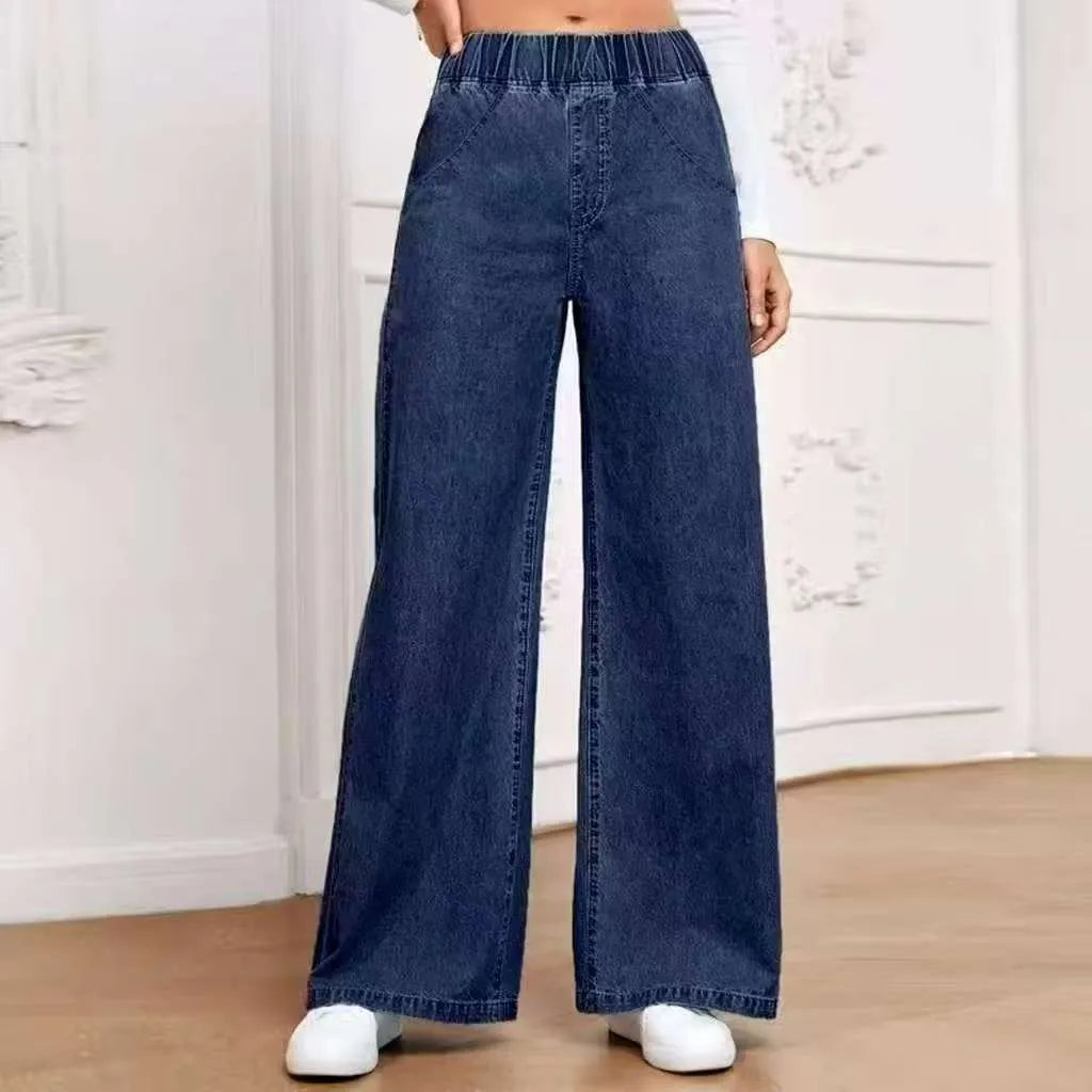 Plus size light blue washed denim jeans with wide-leg straight cut and mid-rise waist