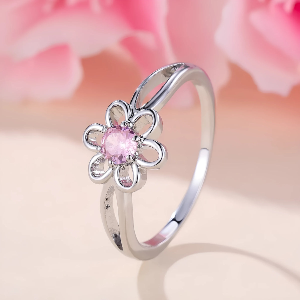 Women's floral hollowed fashion ring in electroplated finish showing flower design detail